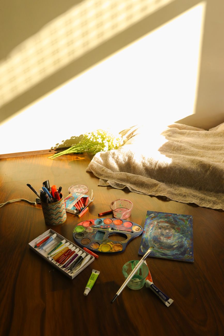 cozy artistic workspace with watercolors
